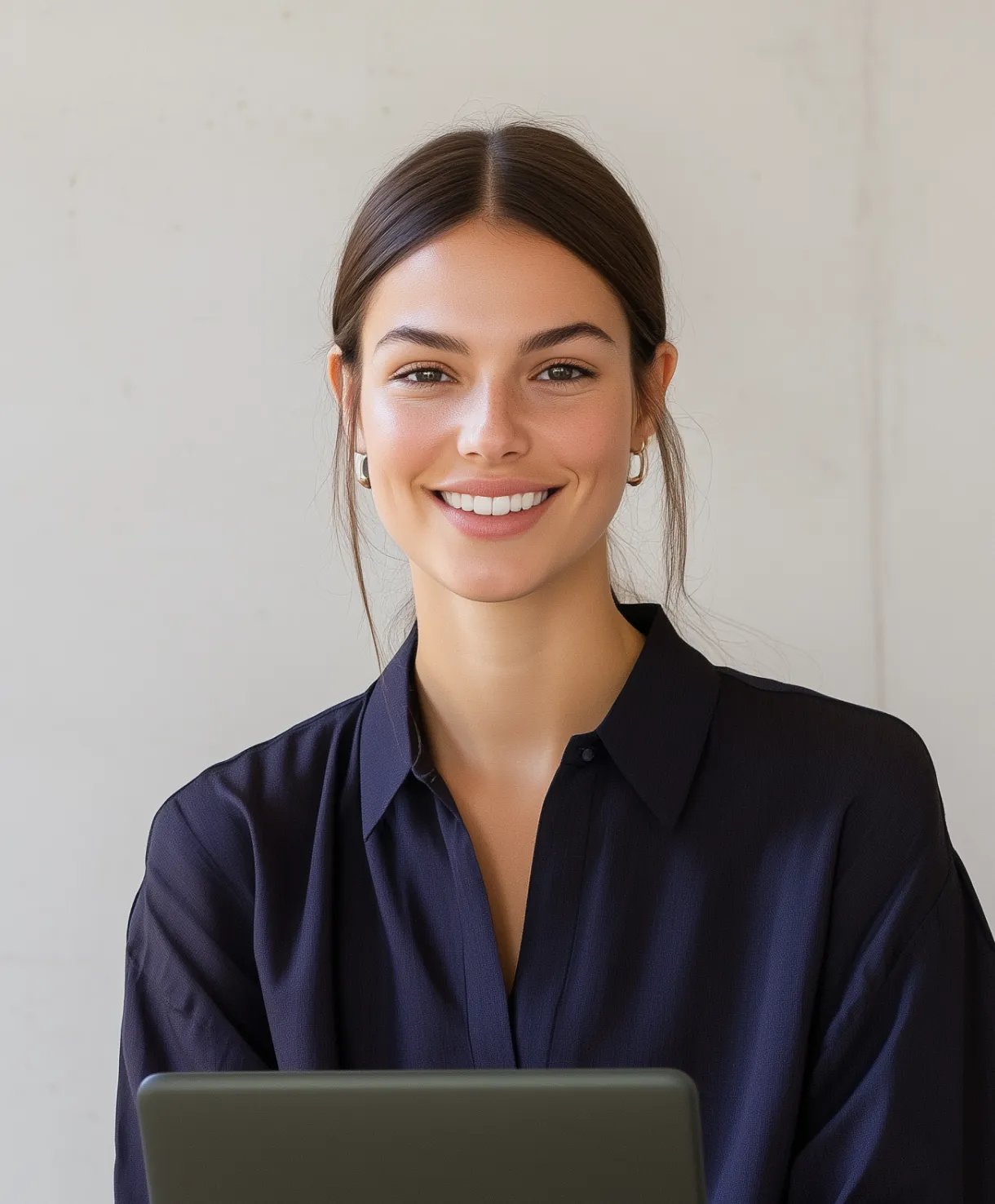 A finance manager reviewing the Makit dashboard on a laptop